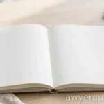 An open blank notebook with a pen beside a short list motif (no legible words), daylight, no text
